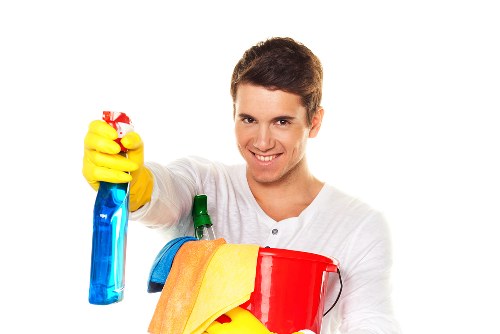 Staff managing hoses and wet flooring to reduce slip risks